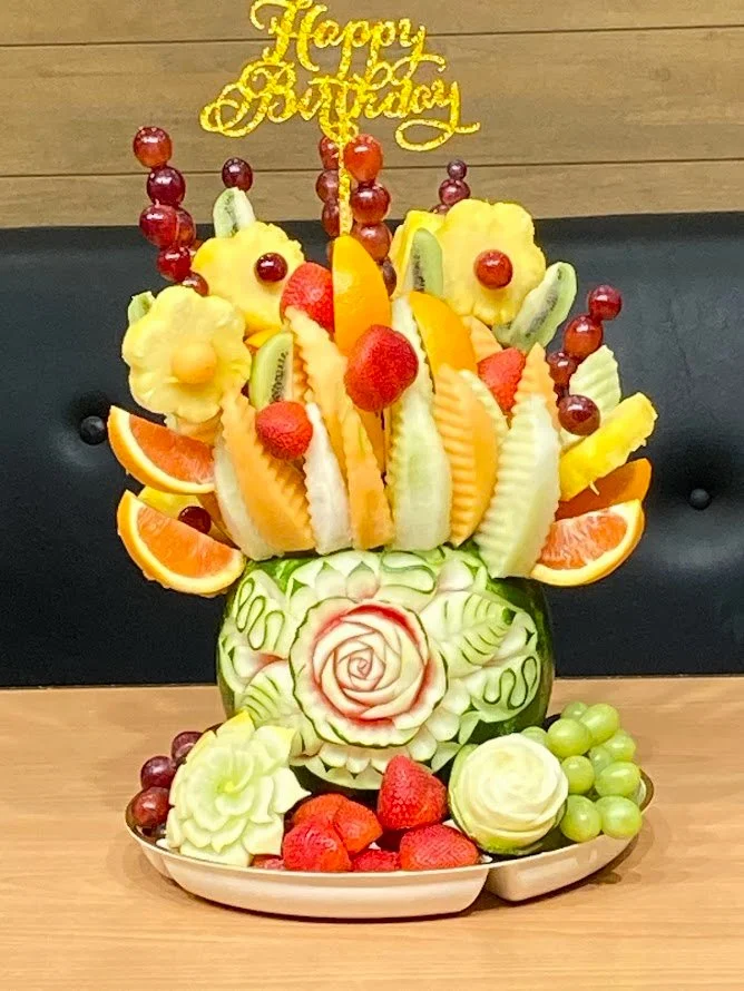 Watermelon platter with berries and fruit carved floweras